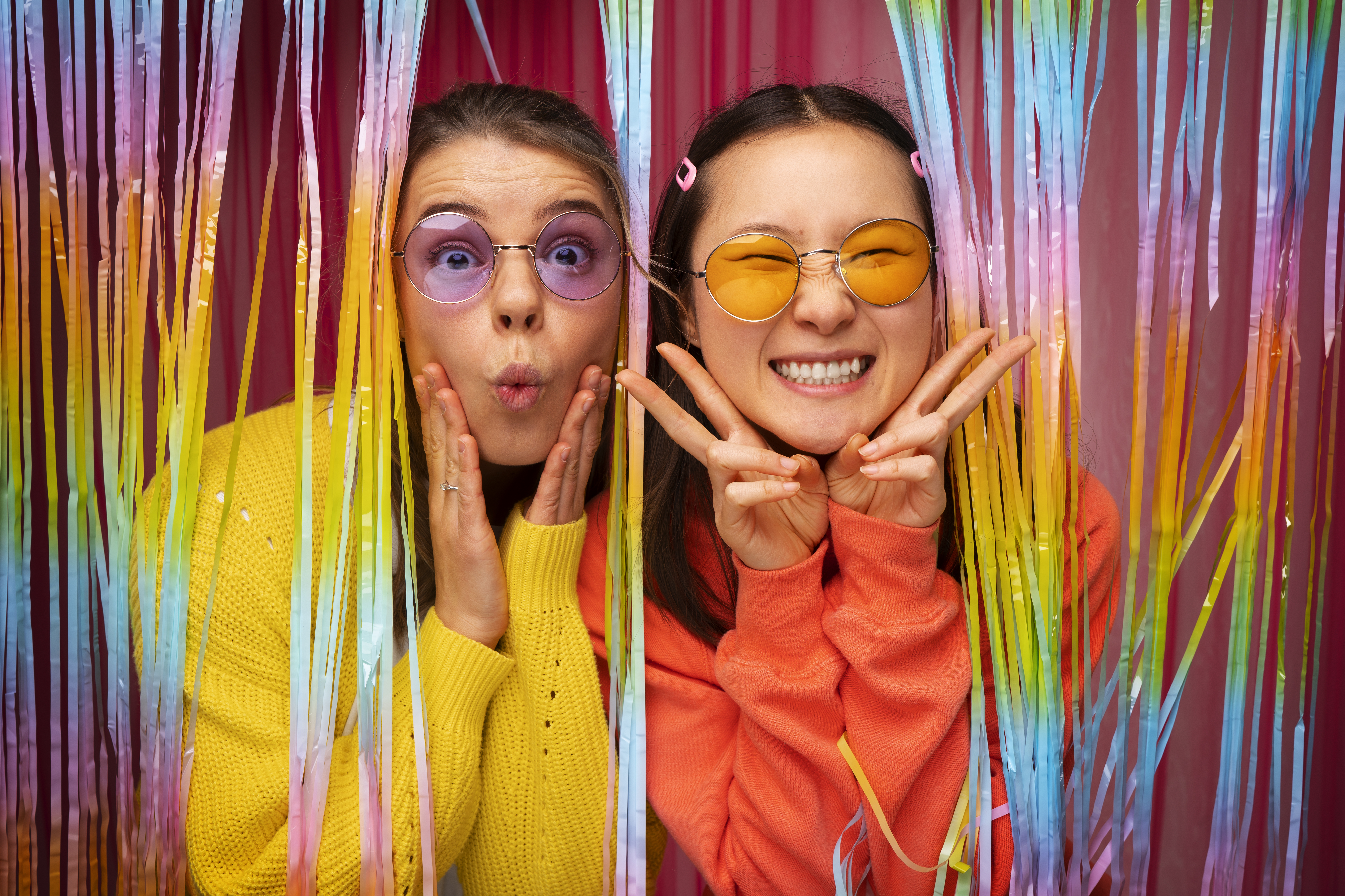 medium-shot-friends-posing-photo-booth (2)