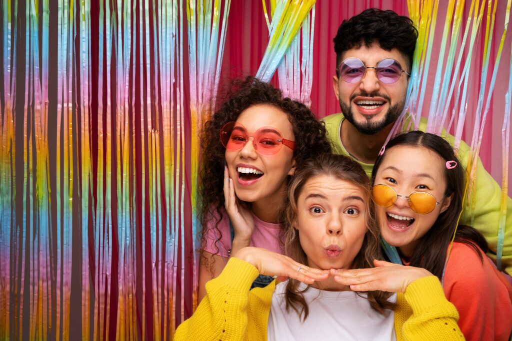 medium-shot-friends-posing-photo-booth (1)